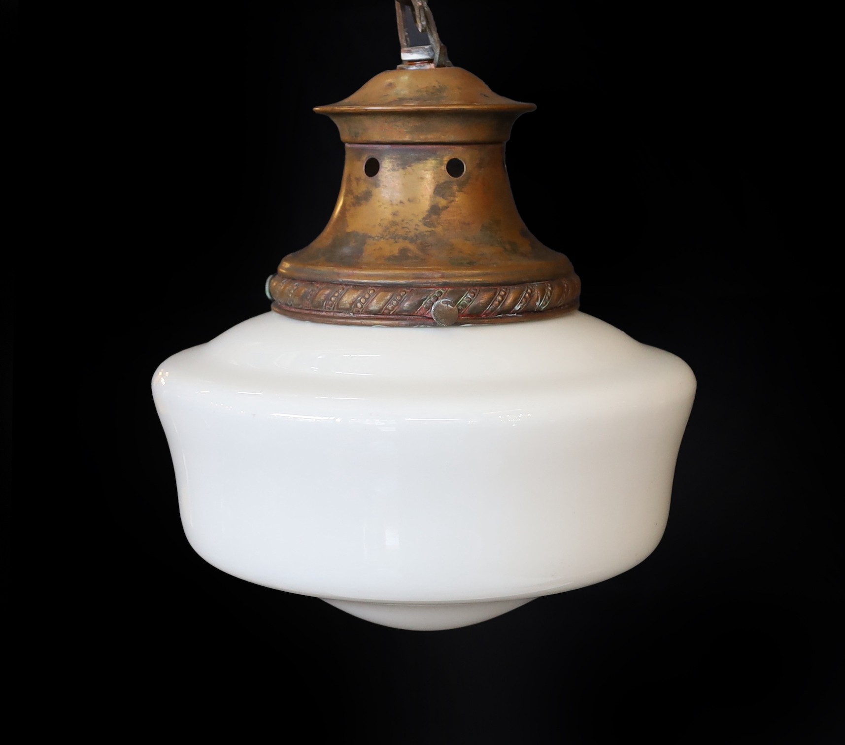 A 1930s English copper ceiling light with opaque glass shade, height 30cm